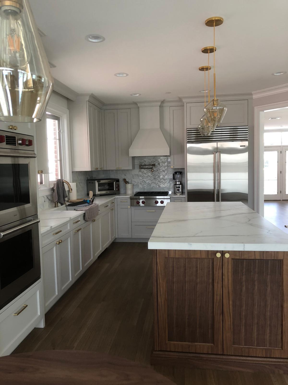 Kitchen with marble island and Wolf range